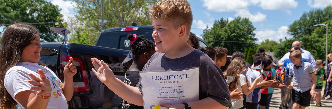 students high fiving